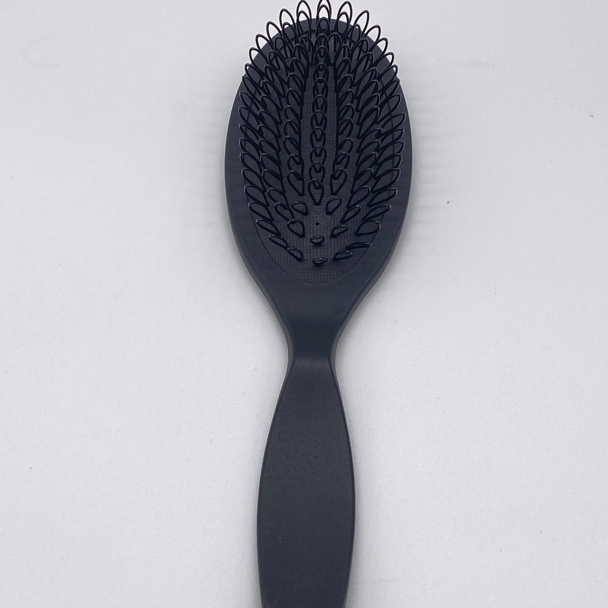 Aveda Pramasana Exfoliating Scalp Brush with soft bristles.